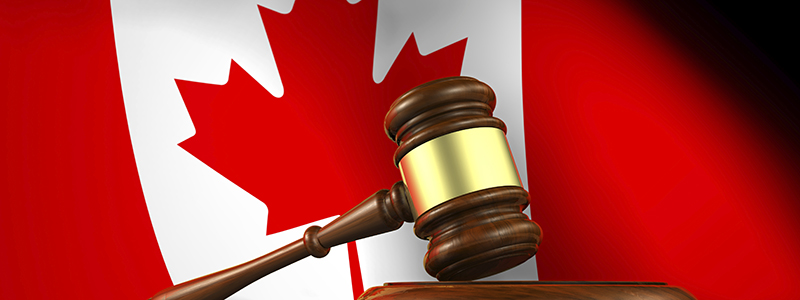 Gavel in front of Canadian flag