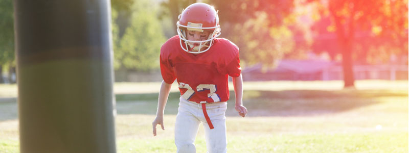 A photo of a boy at football practice. Head injury. Brain injury. Concussion. Concussion symptoms. Head trauma. Head injury symptoms. Signs and symptoms of a concussion. Bump on the head. What are the symptoms of a concussion. What are the symptoms of a headache that won’t go away. How can I detect a head injury. What should I do if I have a concussion/ head injury. How can you get a brain injury. What are some brain injury symptoms. Should I talk to a lawyer about my head injury. Should I visit a doctor after hitting my head. What are the signs of a head injury. What are the signs and symptoms of a concussion. What are the types of concussions. Do I have a concussion. Head injury assessment. Mild concussion symptoms. How To Detect A Traumatic Head Injury