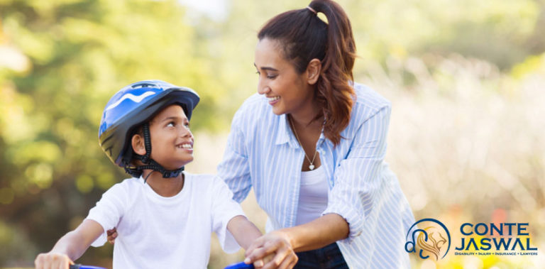 A photo of a mother training her son on how to ride a bicycle. bike safety tips. bike safety for kids. bicycle for kids. kids bikes. helmet safety. children bike helmets. bike helmet. kids bike helmets. toddler helmets. best bike helmets. cool bike helmets. How can I convince my child to wear a bicycle helmet. Teaching kids to wear helmets. Tips on how to make bicycle helmets cool for kids to wear. What are the risks of not wearing a helmet. How to trick my kid to wear a helmet. Why should children use helmets. Is it legal/illegal not to wear a bike helmet. How to educate my child on the importance of helmets. How to prevent head injuries in children. Convince Your Kids To Wear A Bicycle Helmet