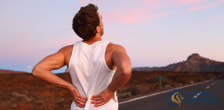 A photo of a man out for a run whose experiencing a herniated disc. How To Deal With A Herniated Disc Injury