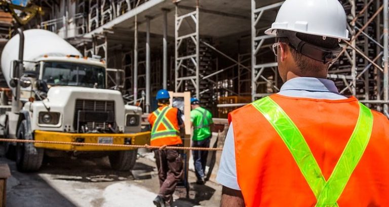 Construction workers at a downtown office building. Injury while at work? Have you been injured while working? Whitby Lawyers, Conte Jaswal and Jane Conte Personal Injury Lawyer.